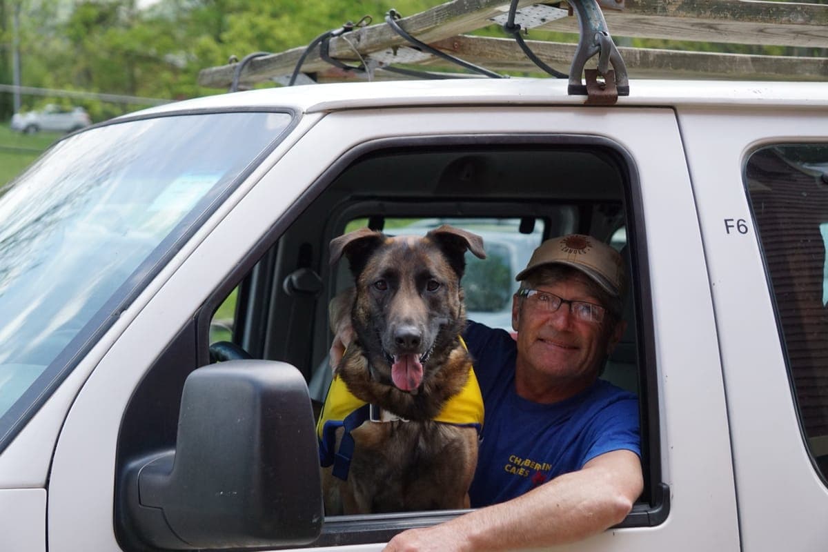 Brad from Chamberlain Canoes with dog in truck